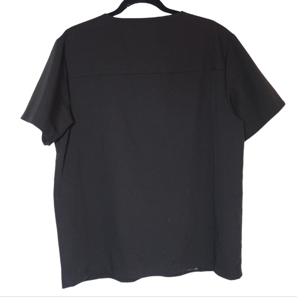 Jaanuu black scrub top. 1 zip chest pocket.  Short sleeve v-neck. Women's size L - Picture 14 of 14